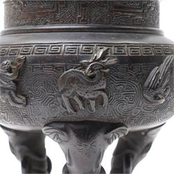 Early 19th century Chinese Qing Dynasty bronze censer, the body of globular form with circular neck and twin cast lion mask ring handles, decorated with applied figures of a monkey, deer and bird, against a key fret detailed ground, the whole upon three zoomorphic elephant feet, H16.4cm D12cm