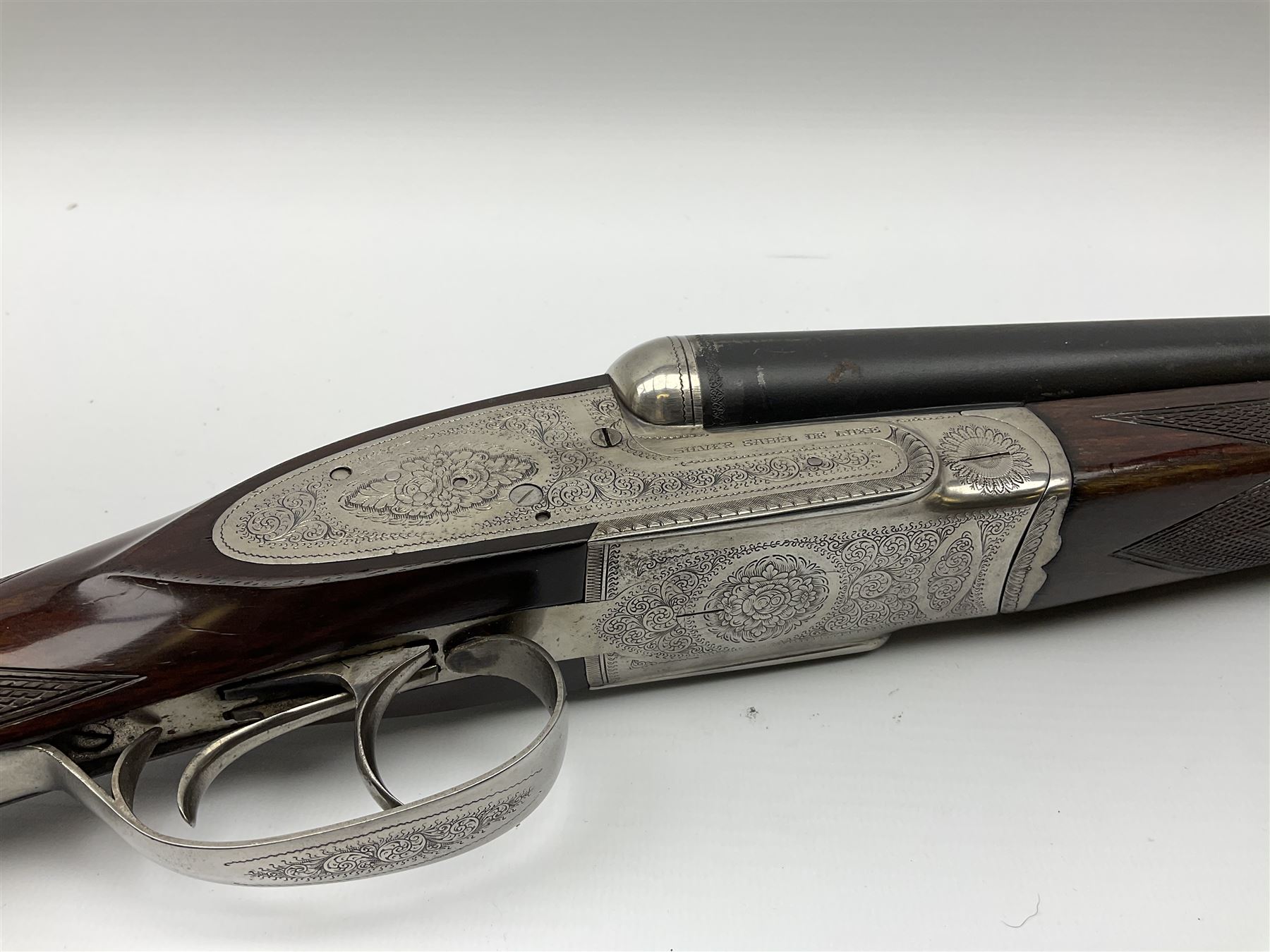 Gunmark Silver Sabel De Luxe 12-bore side by side double barrel side lock ejector sporting gun, 68.5cm barrels with 2.75cm chambers and matt bluing, walnut stock with chequered grip and fore-end and thumb safety, serial nos.12509 & 100.085, L111.5cm overall SHOTGUN CERTIFICATE REQUIRED