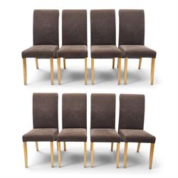 Modern solid oak extending dining table and eight upholstered chairs, the table of plank top construction raised on square supports, extended to 231cm with leaves 