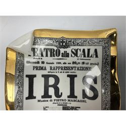 Two Fornasetti rectangular operatic posters ashtrays 'Norma' and 'Iris' decorated with black and white text with a gilt border edge, with printed mark beneath, H16cm