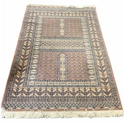 Large rug decorated with geometric bands upon a pink ground, H253cm W163cm