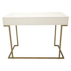 Modern white dressing table, rectangular top above two frieze drawers with bronze metal handles, upon square metal supports