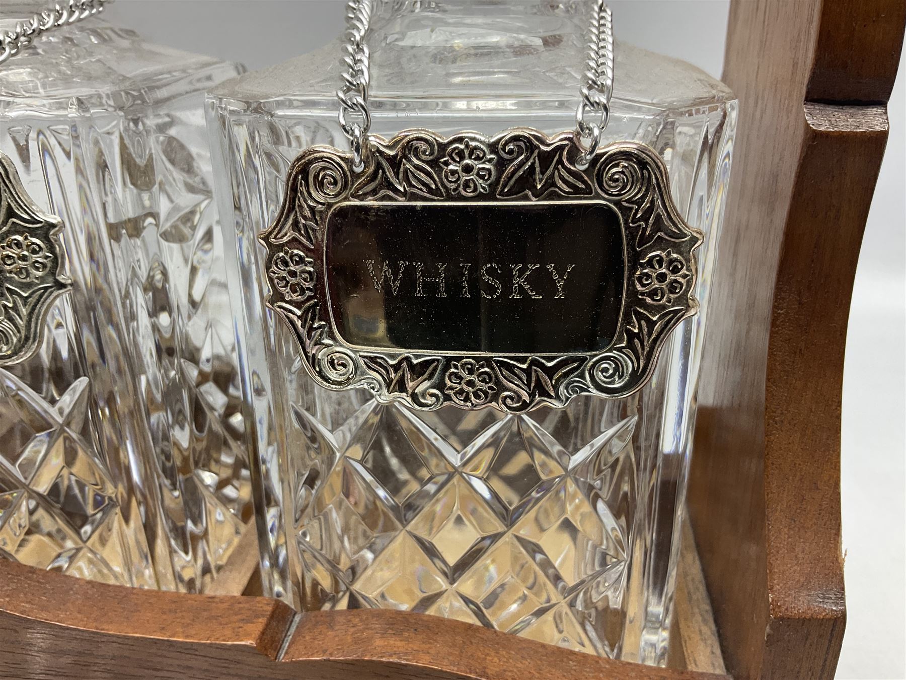 Edwardian silver plate mounted oak tantalus, containing three square sided cut glass decanters, complete with key, H33cm