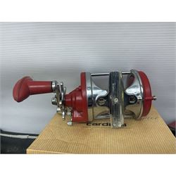 Collection of fishing memorabillia and equipment, including an Allcocks three piece split cane trout fly rod, Shakespeare Salt 3600 surf rod, two tackle bags, Old Red Seastreak multiplier reel, Sportext Saltwater fixed spool reel, fishing dvds, etc