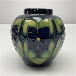Moorcroft ginger jar in Violet pattern by Sally Tuffin upon green ground, with printed mark beneath, H11cm