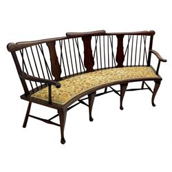 Georgian design curved Windsor settee or settle, shaped cresting rail over triple vase shaped splats and stick back, upholstered seat, on cabriole front supports joined by a series of swell turned stretchers