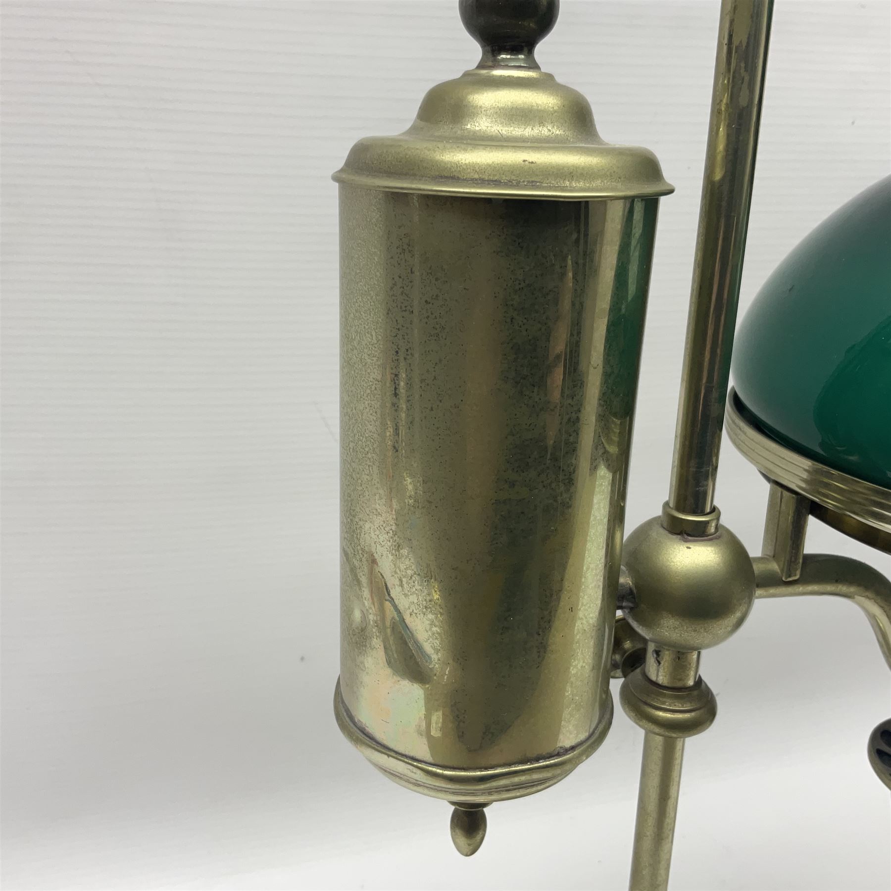 William H Honey polished brass adjustable student's oil lamp, with green glass shade, H60cm