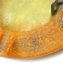 Amalric Walter (1870-1959) and Henri Berge (1868-1936), Nancy, France, circa 1920, pate de verre, Salamander ashtray, bearing moulded mark 'A Walter Nancy' and incised mark 'Berge sc.', D12cm

Note: Almaric Walter, born in Sèvres near Paris, exhibited at the Salon des Artistes Françaises in 1895 and 1903, and in 1908 moved to Nancy where he established his own workshop within the Daum glassworks. There he worked closely with Daum designers, including Henri Bergé. This ashtray is an example of Walter’s pâte-de-verre technique.

Provenance: From the collection of Andrew Chichester Everitt.