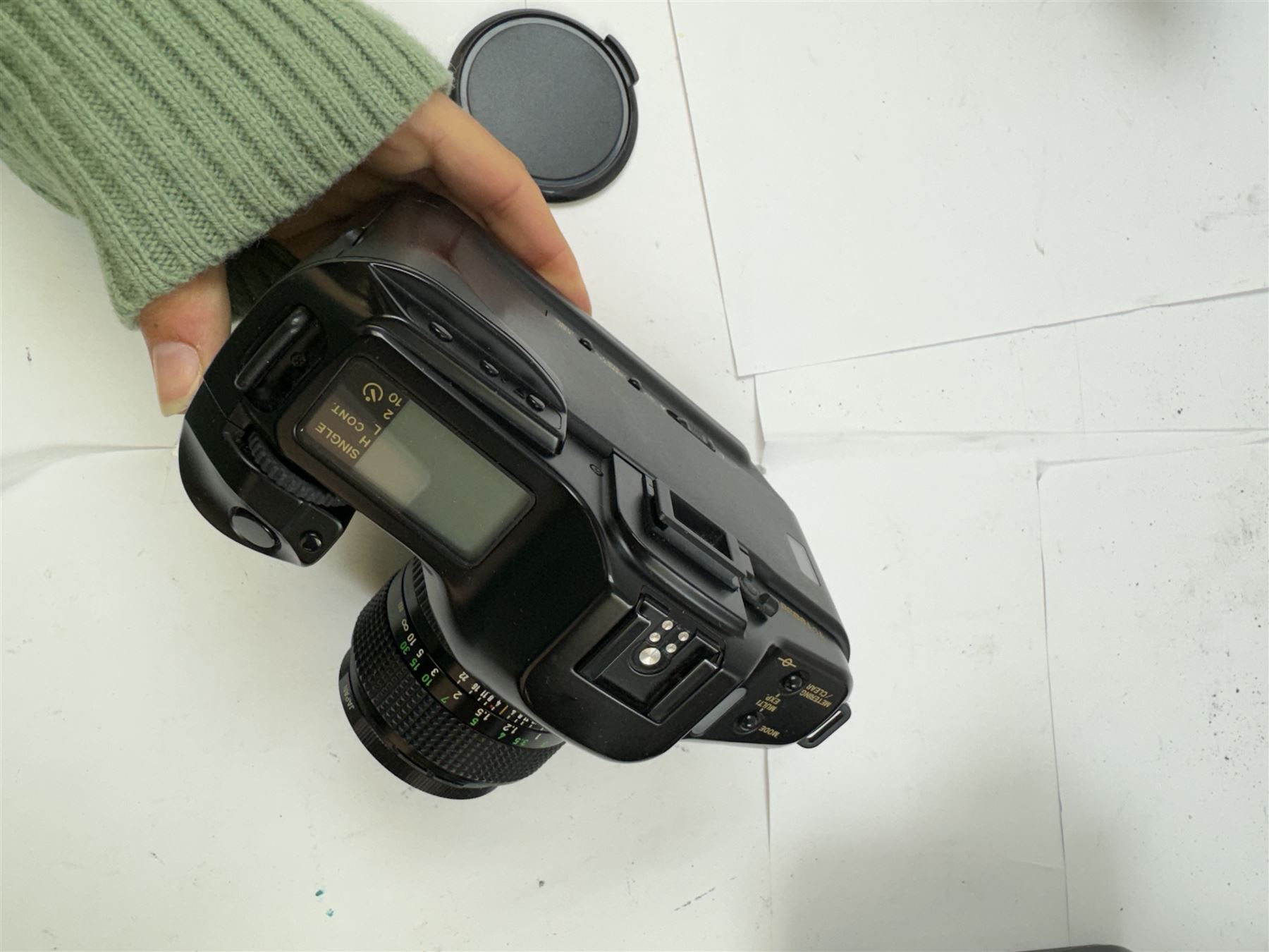 Seven Canon SLR camera bodies, comprising T50 serial no. 2011593, T70 serial no. 1319312, in carry case, two T80 examples, serial nos. 242362 & 256560, one with a Canon AC 35-70mm 1:3.5-4.5 zoom lens, and three T90 examples, serial nos. 1174363, 1005979 & 1019836, one example with a Canon FD 55mm 1:12 lens and one with a Canon FD 50mm 1:1.4 lens, one example with box