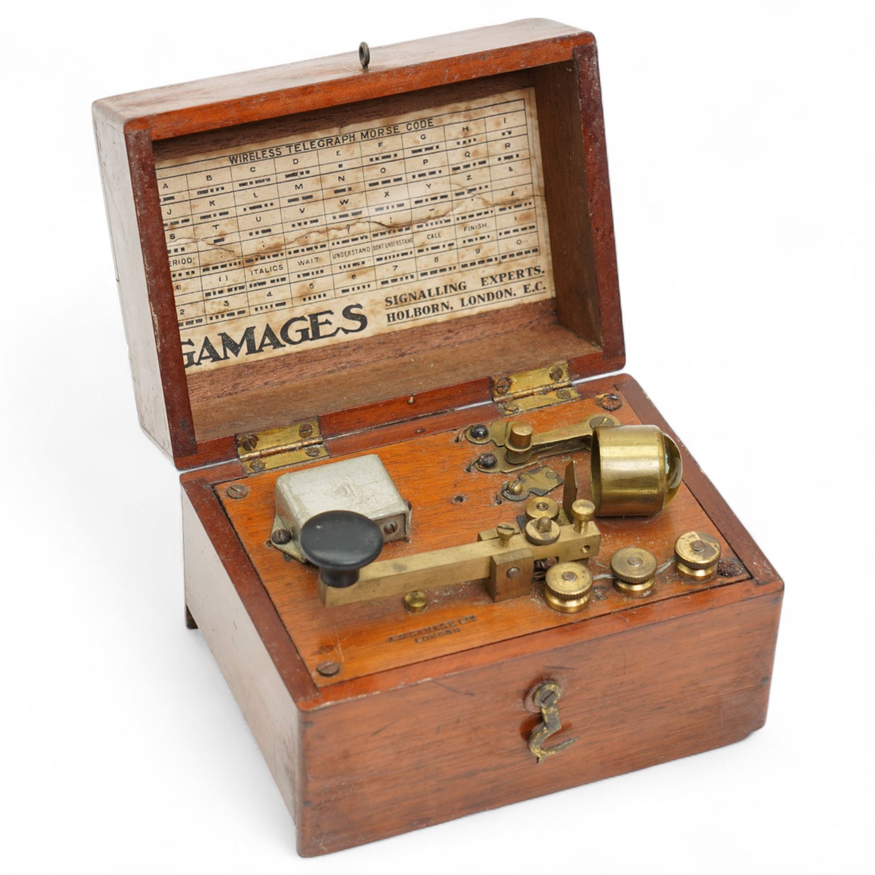 World War II Type B-6 leather flying helmet, property Air Force U.S. Army and a Gamages morse code signaller in mahogany box (2)