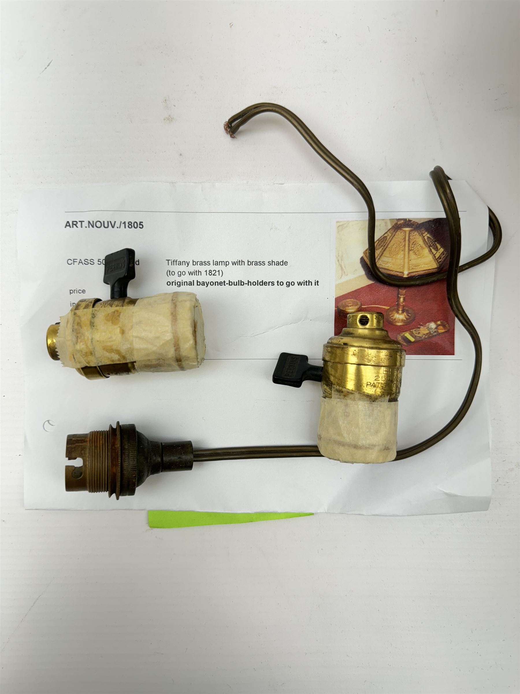 In the manner of Tiffany & Co, early 20th century gilt bronze Adam pattern table lamp, circa 1910, the circular spreading base decorated with flower heads and beaded bands, stiff leaves and husks, leading to a reeded column detailed with stiff leaves and swags, supporting a pierced octagonal shade, with original fittings, stamped beneath Tiffany Studios New York 539, overall H44.5cm


