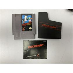 Nintendo Entertainment System (1985) console with two controllers, accessories and instruction booklet. NES Games ‘Duck Hunt’ with Nintendo Zapper gun, ‘Pinball’ and ‘Super Mario Bros.’, all with original sleeves and instruction booklets. NES game ‘Super Mario Bros. 2’ cartridge only