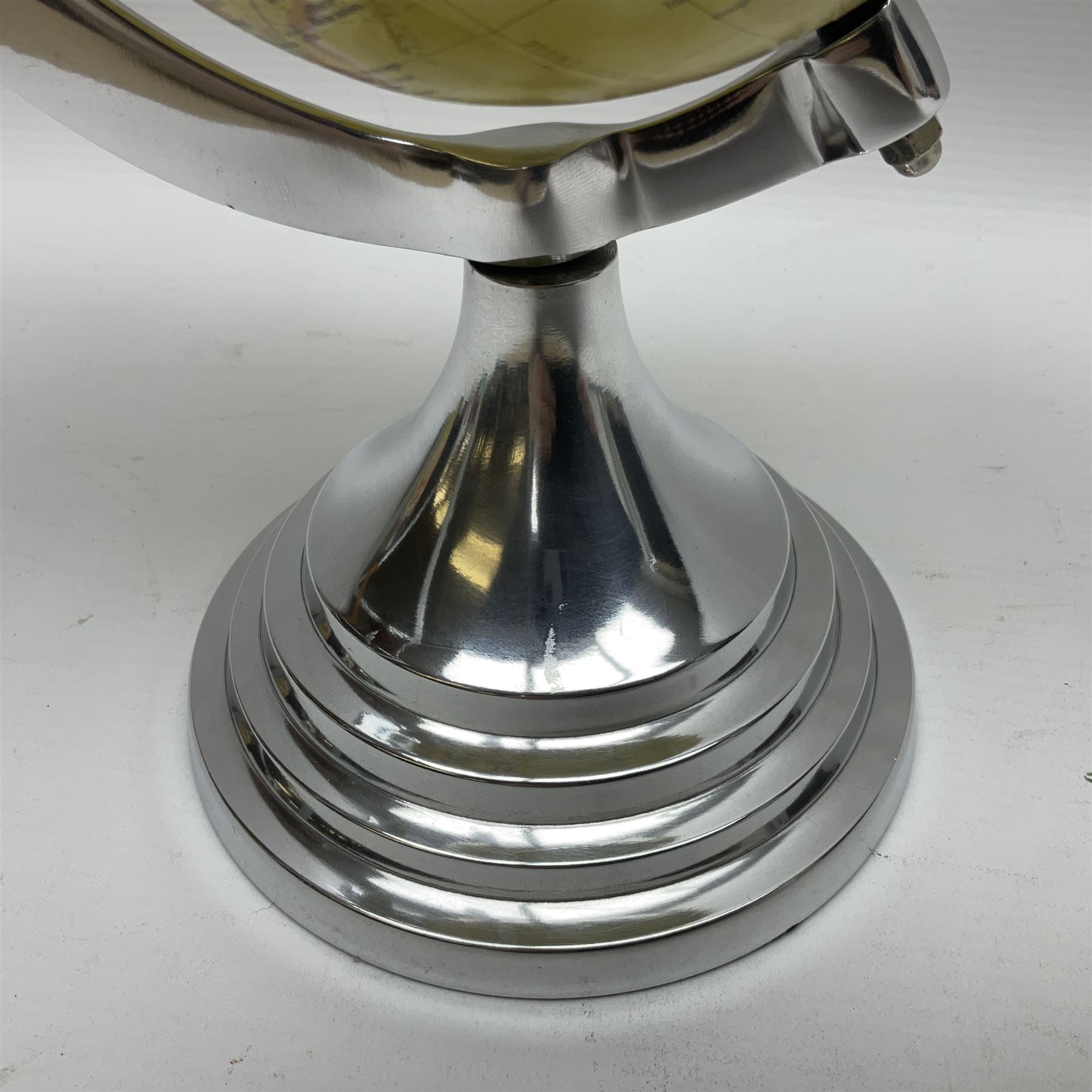 Art Deco style world globe with chrome aeroplane finial and mounts, H31cm