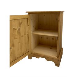 Two small pine bedside cupboards, enclosed by panelled doors