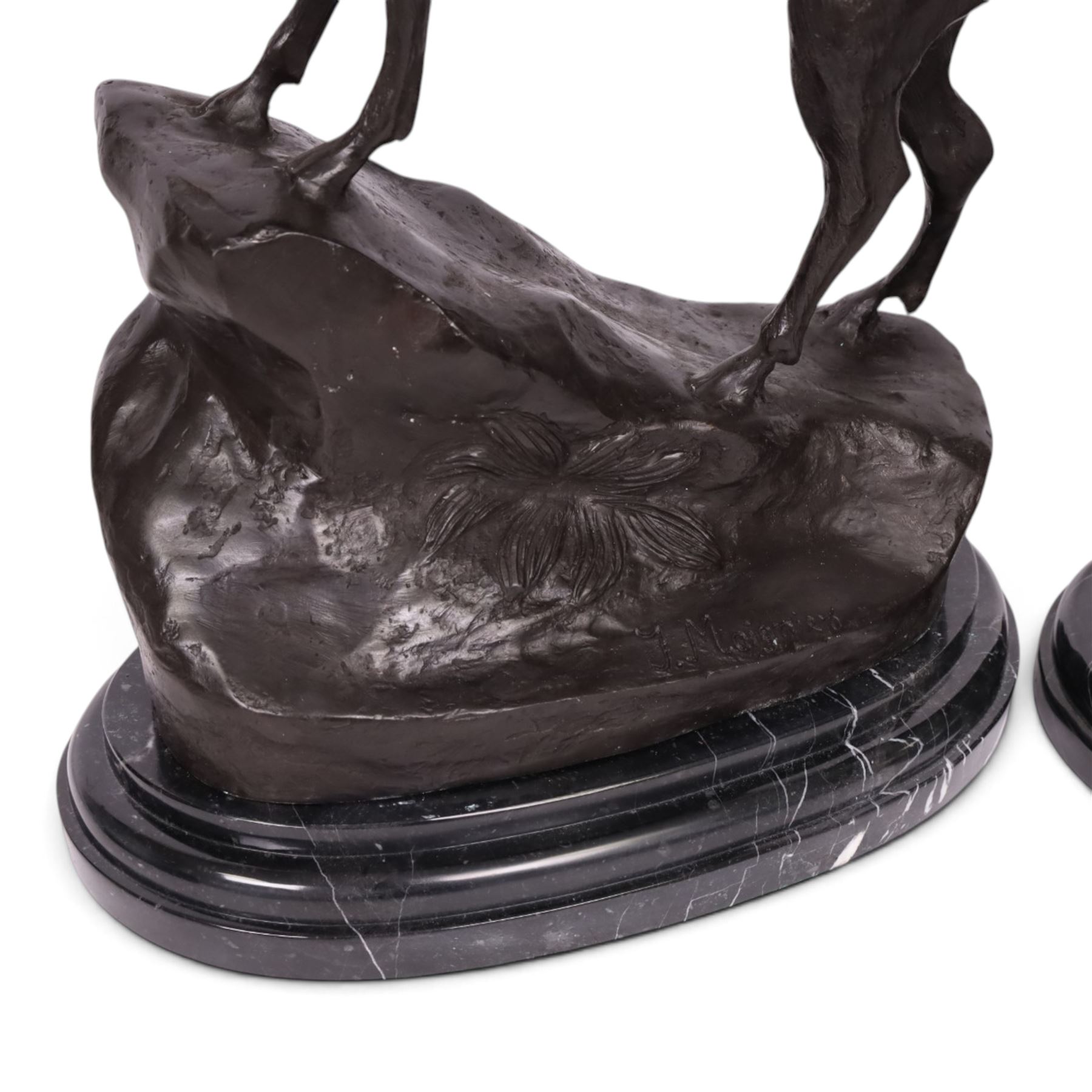 After Jules Moigniez (French 1835-1894): Pair of bronze stag figures on marble bases, each modelled alert standing on moulded rocky plinth on shaped marble bases, H74cm