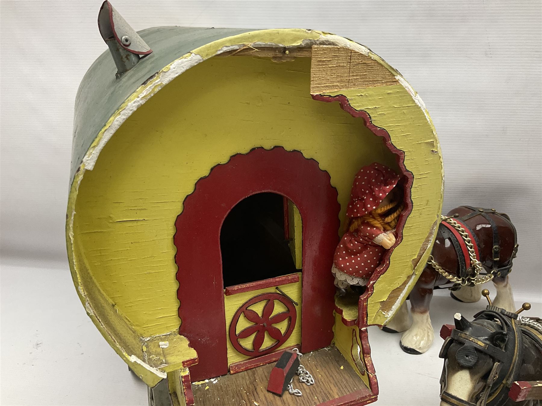Two ceramic shire horse and gypsy caravans, together with horse brasses 