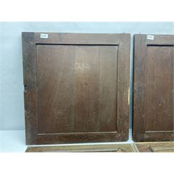Pair of oak furniture door panels, carved in relief with a fox to one and a hound to the other, together with a pair of smaller oak panels, carved in relief with a hare to one and a grouse to the other, doors W63.cm x H62cm, panels W43cm x H60cm