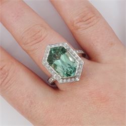 Platinum African Paraiba tourmaline and diamond ring by Scarab London, single fancy double bullet cut tourmaline of approx 8.37 carat, with round brilliant cut diamond surround and diamond set shoulders, London 2023, total diamond weight approx 1.05 carat, with Alan Poultney Gems report