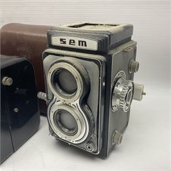 Franke & Heidecke Rolleicord twin lens camera, serial number 012706 with Heidoscop-Anastigmat f=7.5cm' lens and a 'Carl Zeiss Jena Triotar 1:4.5 f=7.5cm' lens, serial no 1474898, together with three similar cameras, including SEM TLR, serial no 420218, Ising Pucky box and Ferrania Elioflex, three in leather carry cases