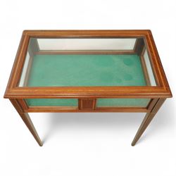 Edwardian satinwood and inlaid bijouterie table, rectangular hinged glazed top above a baize-lined interior, frieze with panelled inlay detail, raised on square tapered legs with boxwood and ebony stringing