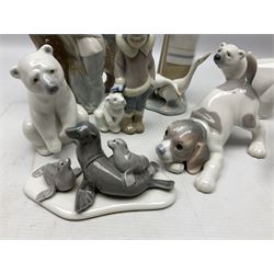 Seven Lladro figures, comprising Playful Puppy no 9135, Platero and Marcelino/Boy Hugging Donkey no 1181, Mini Seal Family no 5318, Attentive Polar Bear no 1207, Seated Polar Bear no1209, Eskimo Boy with Pet no 5238 and Girl with Geese no 1035, together with Nao goose