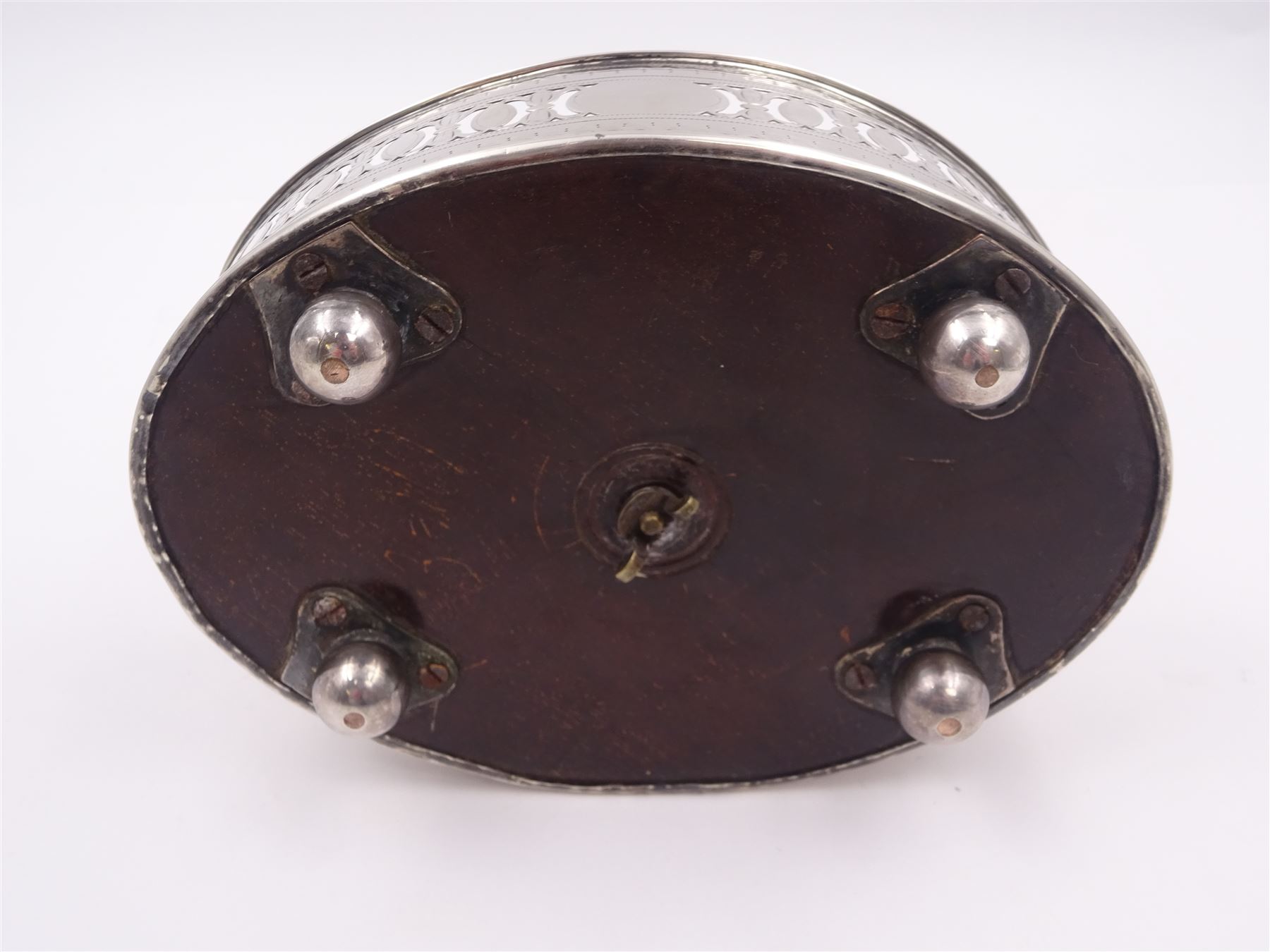 Late 18th century silver cruet stand, of oval form, with pierced sides upon four bun feet, hallmarked to handle Hester Bateman, all other hallmarks indistinct, together with five matched silver mounted cut glass cruet bottles, including some later Victorian examples, hallmarks predominantly indistinct, stand H20cm