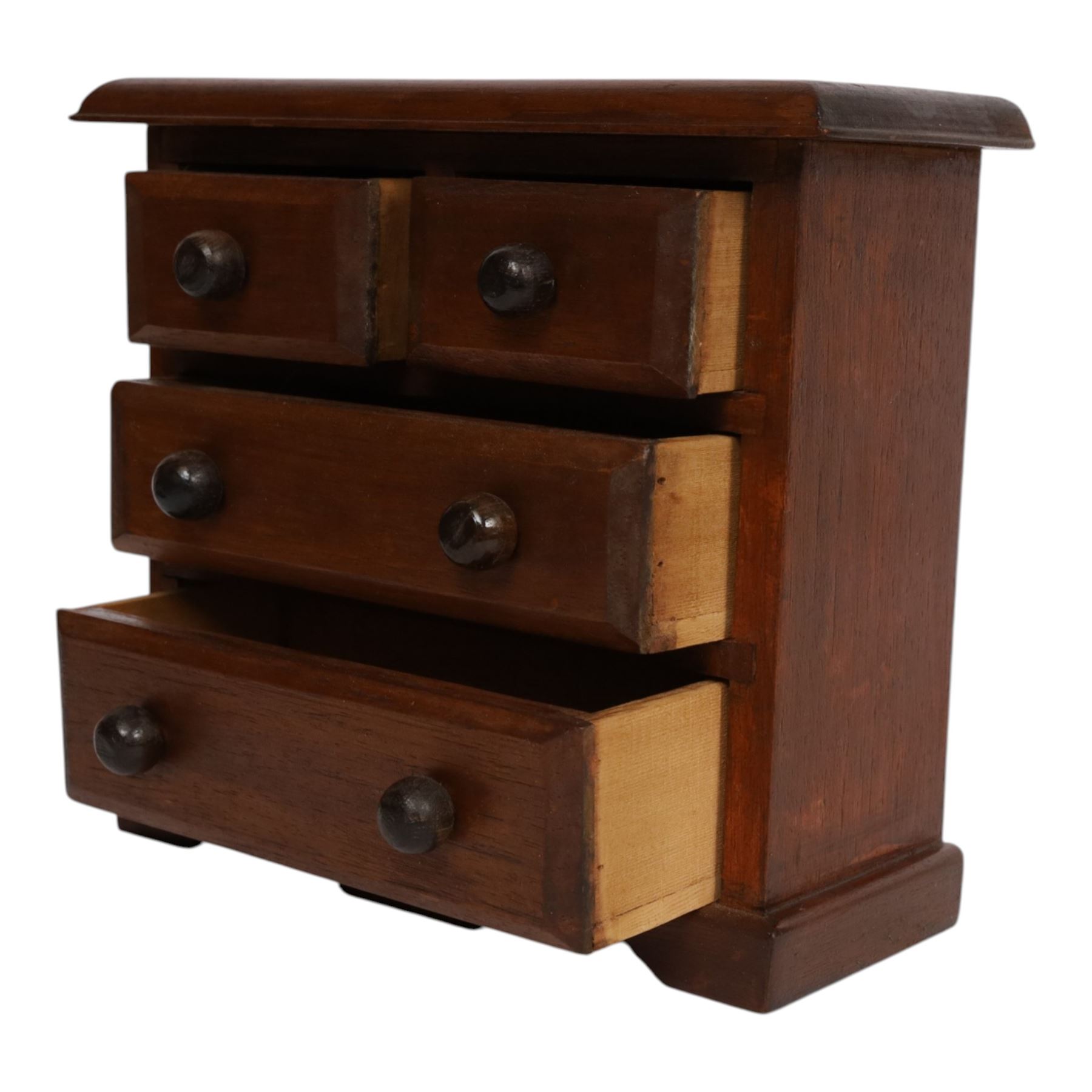 Table top chest of draws, fitted with three draws, upon a skirt base, together with another table top chest 