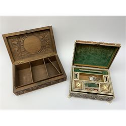 An early 20th century Indian Vizagapatam box, detailed with pierced ivory panels and raised upon four paw feet, H8cm L20.5cm D15.5cm, together with an Eastern hardwood box carved with foliate panels. 