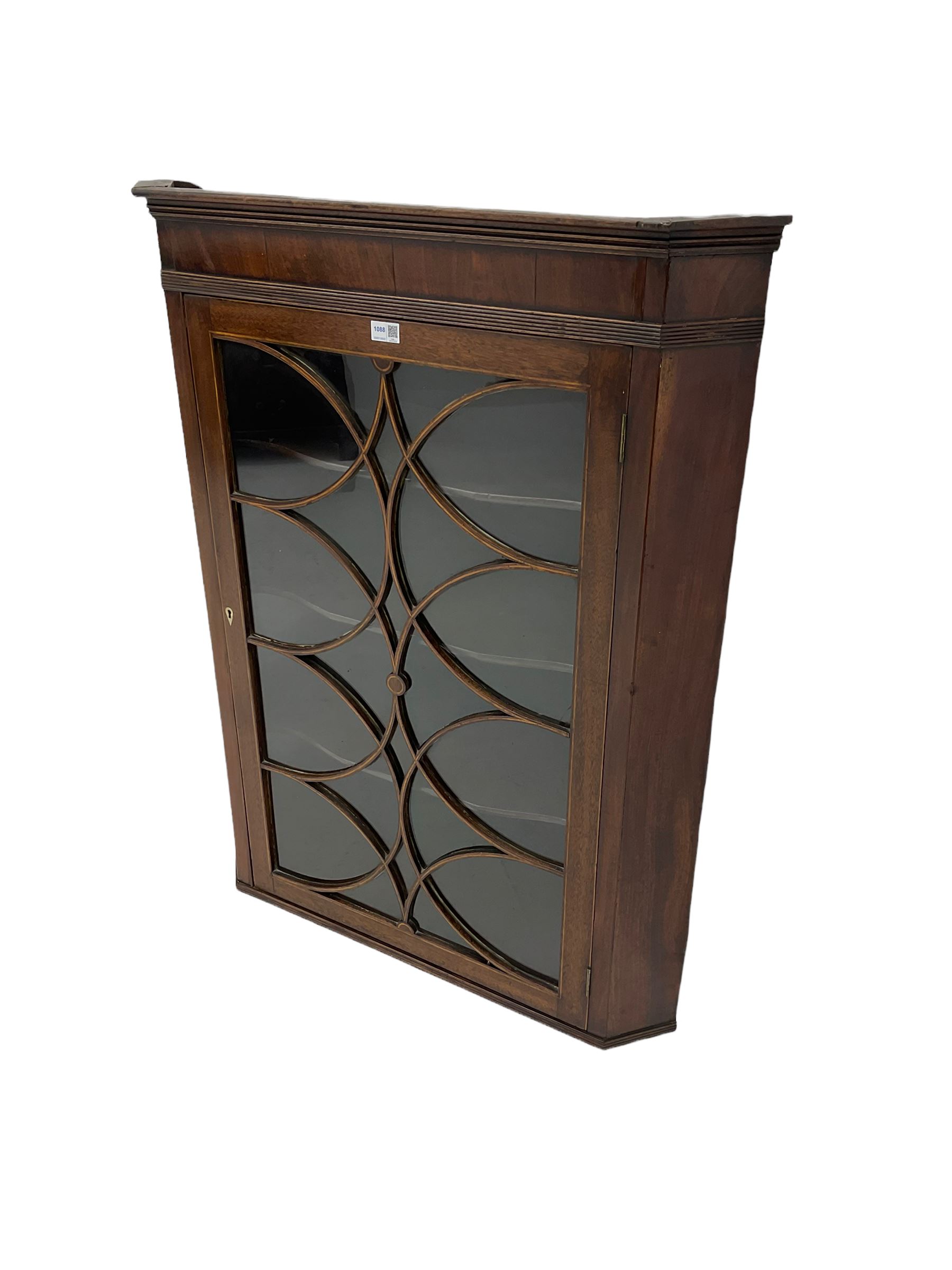 Georgian mahogany wall hanging corner cabinet, enclosed by single door with curved interlacing astragal glazing 