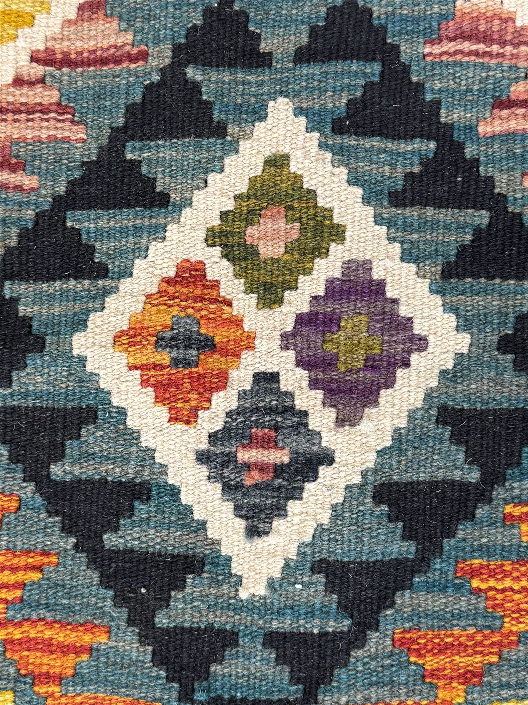 Afghan Maimana Kilim flatweave rug, teal ground with a vibrant multicoloured diamond lattice, framed by stylised border motifs and finished with fringed edges