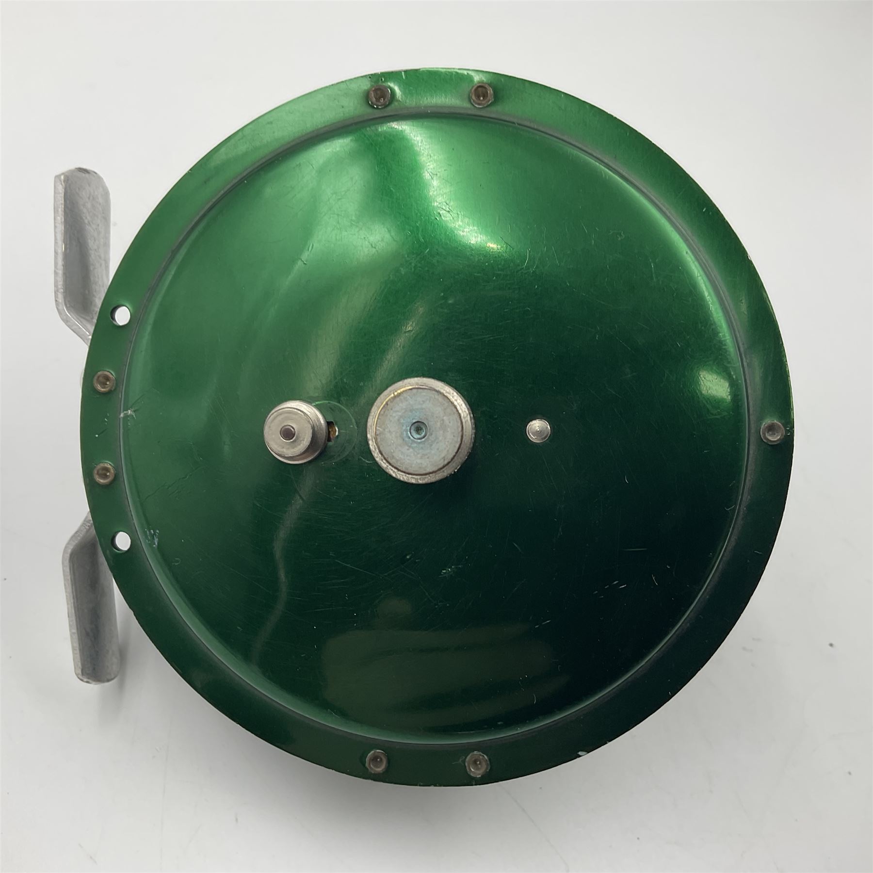 TO RTV Three fishing reels, including American Pflueger progress bulldog size 60 brass and chrome skeleton fly reel, with wooden handle; Maginot 106 fly reel and an alloy reel (3)