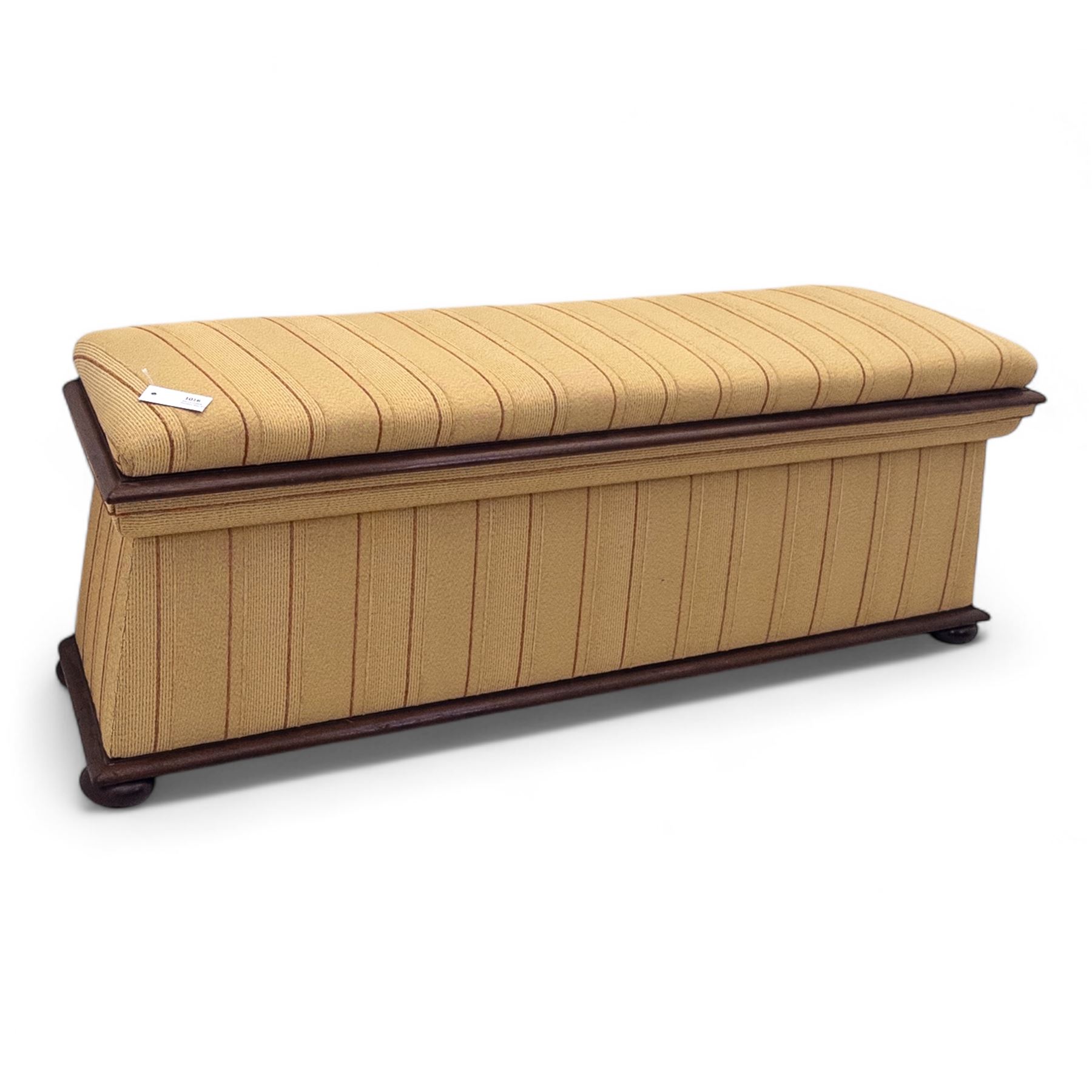 Late Victorian angular framed mahogany bay window seat, hinged lid with moulded upholstered padded seat, over upholstered front and sides, raised on compressed bun feet  