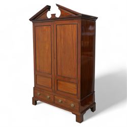 George III mahogany wardrobe, broken sloped arch pediment with dentil moulding over two panelled doors, the base fitted with two cock-beaded drawers, on bracket feet, knock-down construction 