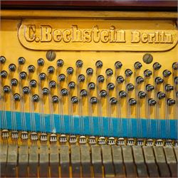 Claud Bechstein- German model IV overstrung upright piano in a mahogany Arts & Crafts designed case by Walter Cave, Serial number 56589 (1900-01), with a lattice music desk and silk backed open fretwork, square key fall with makers name and crafted brass hinges, two candle sconces on tapered square supports, makers name and model number cast into the frame, with an underdamper action, una-corda and sustain pedals, recently re-strung with new tuning pins, responsive action and damping, in very good playing condition, with 85 ivory and ebony keys A0-A7, tuning A=440. Including a period duet stool with a velvet-padded top.
Walter Cave was a leading architect, interior designer, and furniture maker during the Arts & Crafts period, a similar piano to this was owned and played by George Bernard Shaw and is on exhibition at the National Trust property, Shaw's Corner (Hertfordshire).

This item has been registered for sale under section 10 of the APHA Ivory Act, Reference 8P3C9UKA
