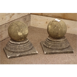  Pair composite stone spherical gate post toppers on stepped bases, 37cm x 37cm  
