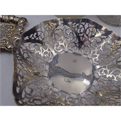 Group of silver, comprising bon bon dish with pierced sides, hallmarked Deakin & Francis Ltd, Birmingham 1973, two pin dishes, two glass bottles with silver lids and two glass jars with silver lids, all hallmarked