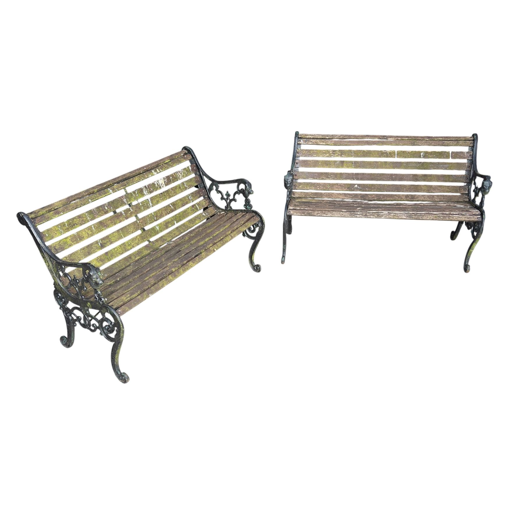 Pair of Victorian Revival Coalbrookdale design 'Dog and Serpent' pattern benches with slatted seats, the cast iron end supports of pierced and scrolling design with dog mask arm terminals