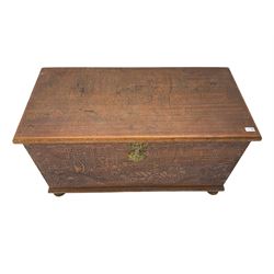 Hong Kong camphor wood chest, rectangular hinged top, carved all over with traditional scenes and dragon boats, on bun feet