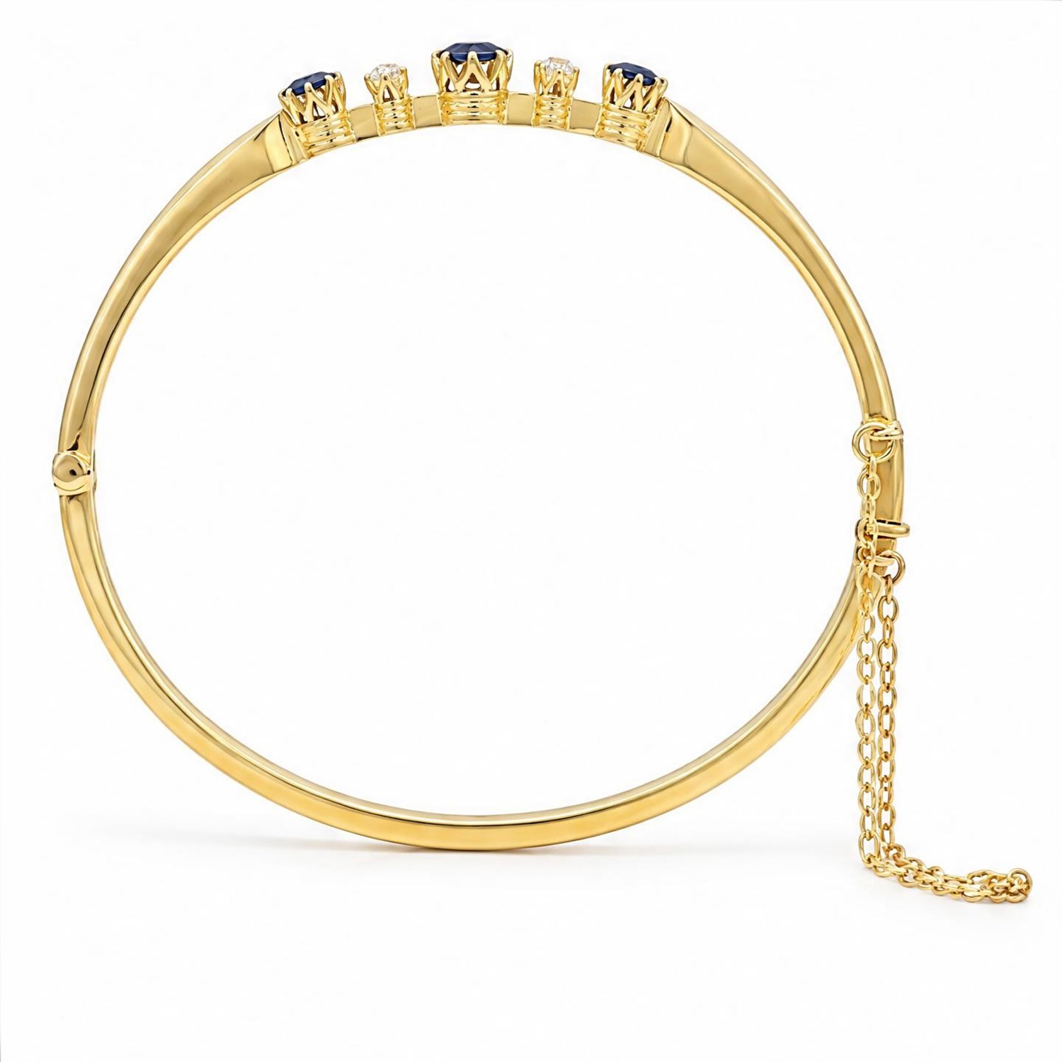 Early 20th century 18ct gold sapphire and diamond hinged bangle, the front set with three round cut sapphires and spaced by two old cut diamonds, total sapphire weight approx 1.15 carat