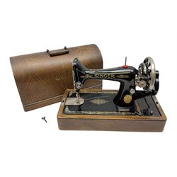 Singer sewing machine in wood case with key