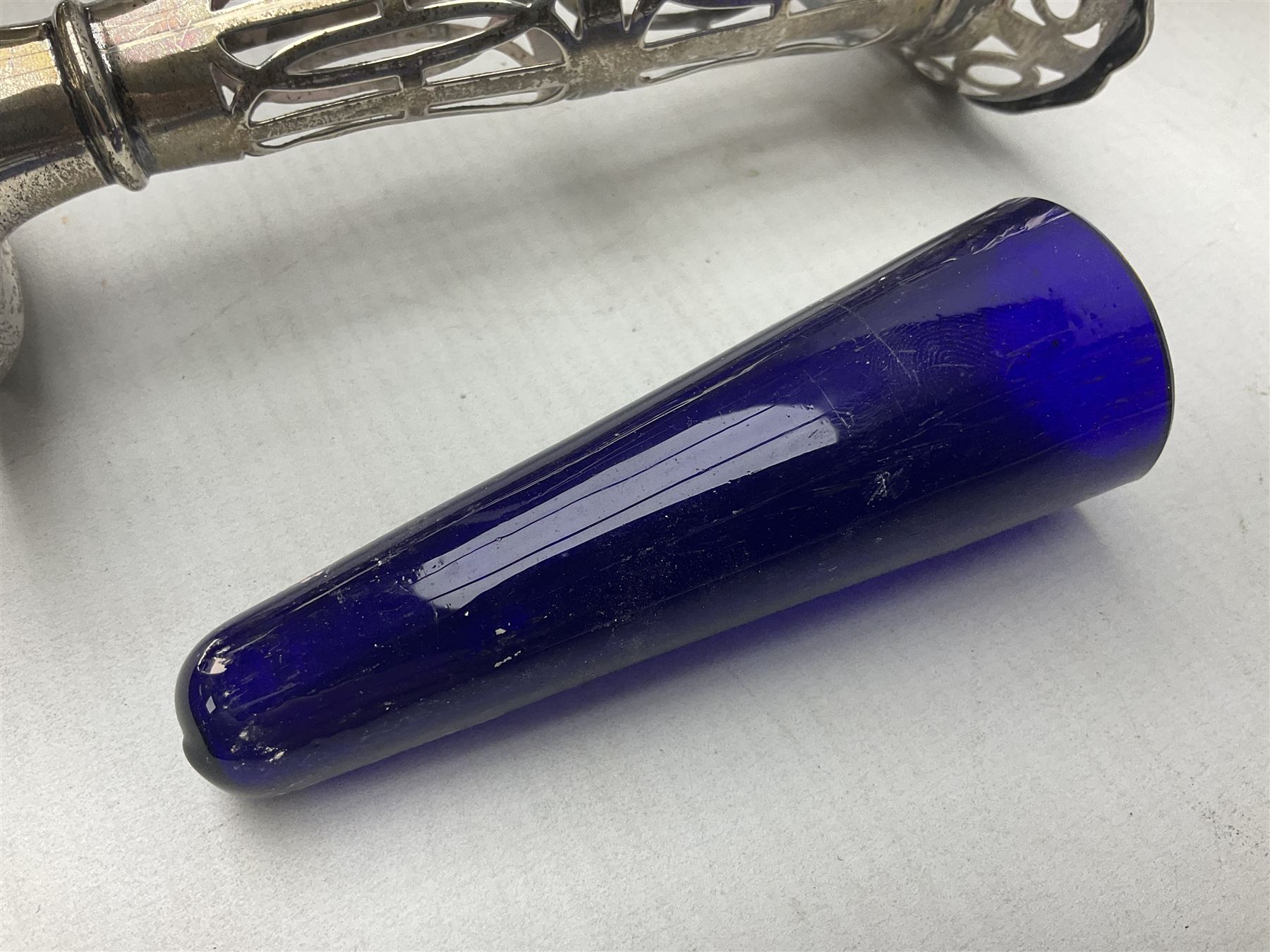 20th century silver specimen vase, of pierced trumpet form with flared rim, filled base, and blue glass liner, hallmarked Birmingham 