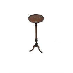 20th century mahogany jardiniere stand, shaped top, turned tapering column on three shaped supports 