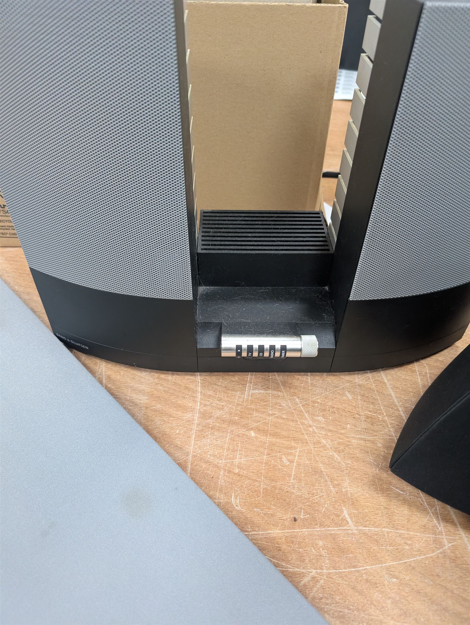 Four Bang & Olufsen Beolab pyramid speakers, Beolab 2000 speakers, two TV frets, phones, etc