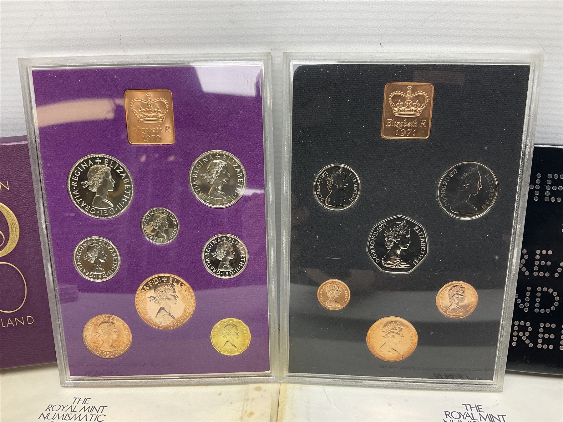 Two Great Britain and Northern Island proof sets dated 1970 and 1971, both with card cases, three 1986 Commonwealth Games commemorative two pound coins, in card folders, and six brilliant uncirculated one pound coins, in card folders