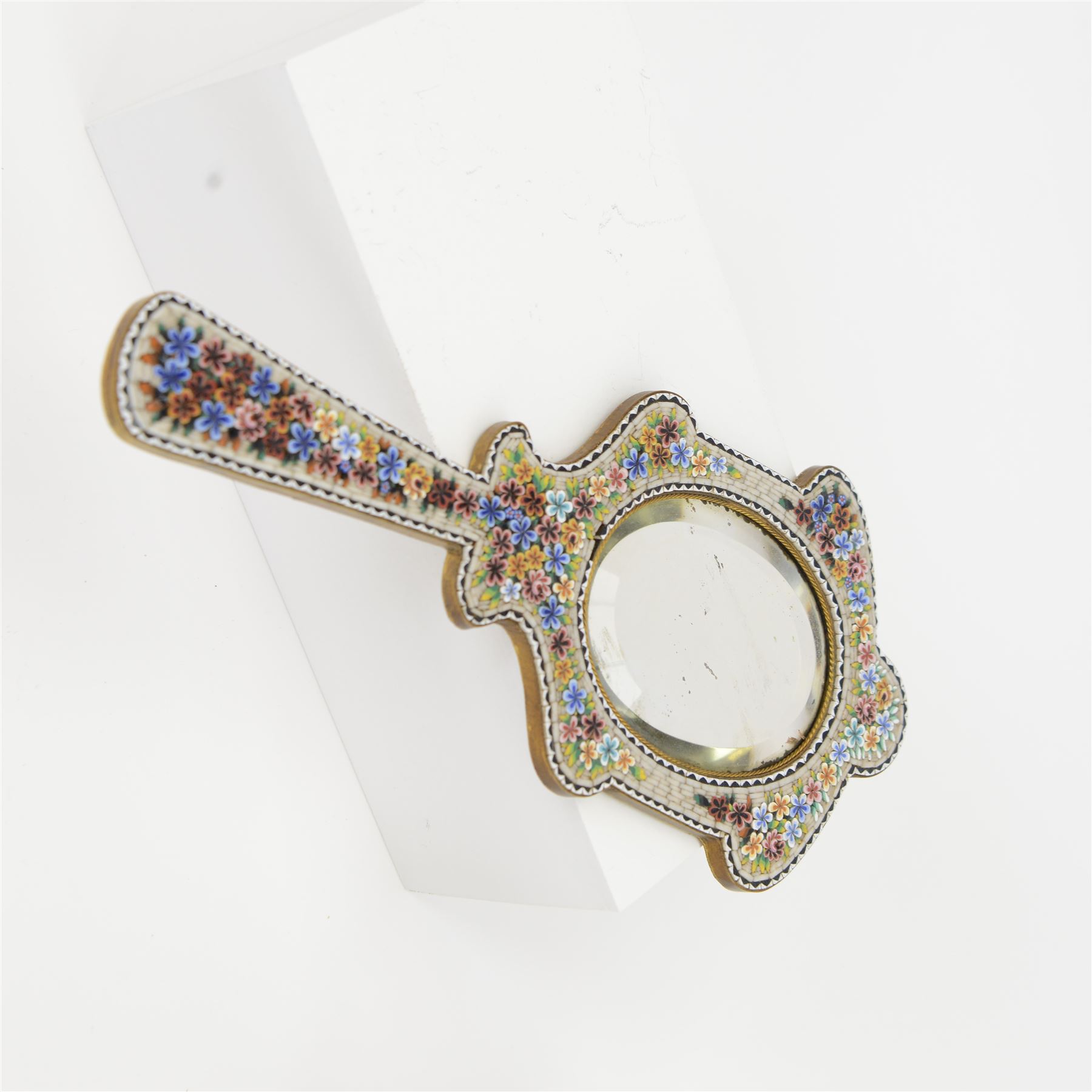 Venetian micro mosaic framed hand mirror, the bevelled oval plate surrounded by colourful flowers against a cream ground, together with another, largest H23cm 