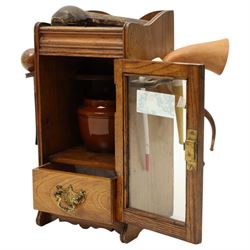 Small Edwardian oak smoker's cabinet with tobacco jar, Meerschaum pipe, three clay pipes, cigar cutter etc