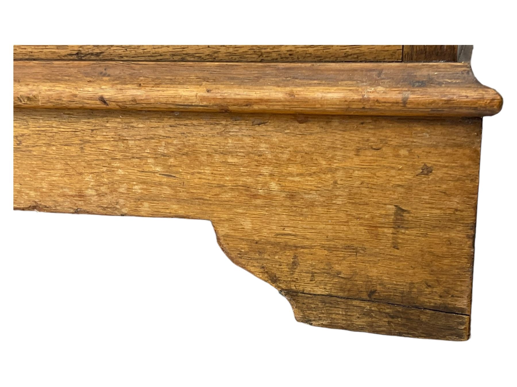 Late Victorian walnut triple combination wardrobe, projecting moulded and dentil cornice, central shaped bevelled mirror glazed door, cartouche and curled leaf carved panels over figured walnut veneered panels, fitted with drawer to base, on bracket feet