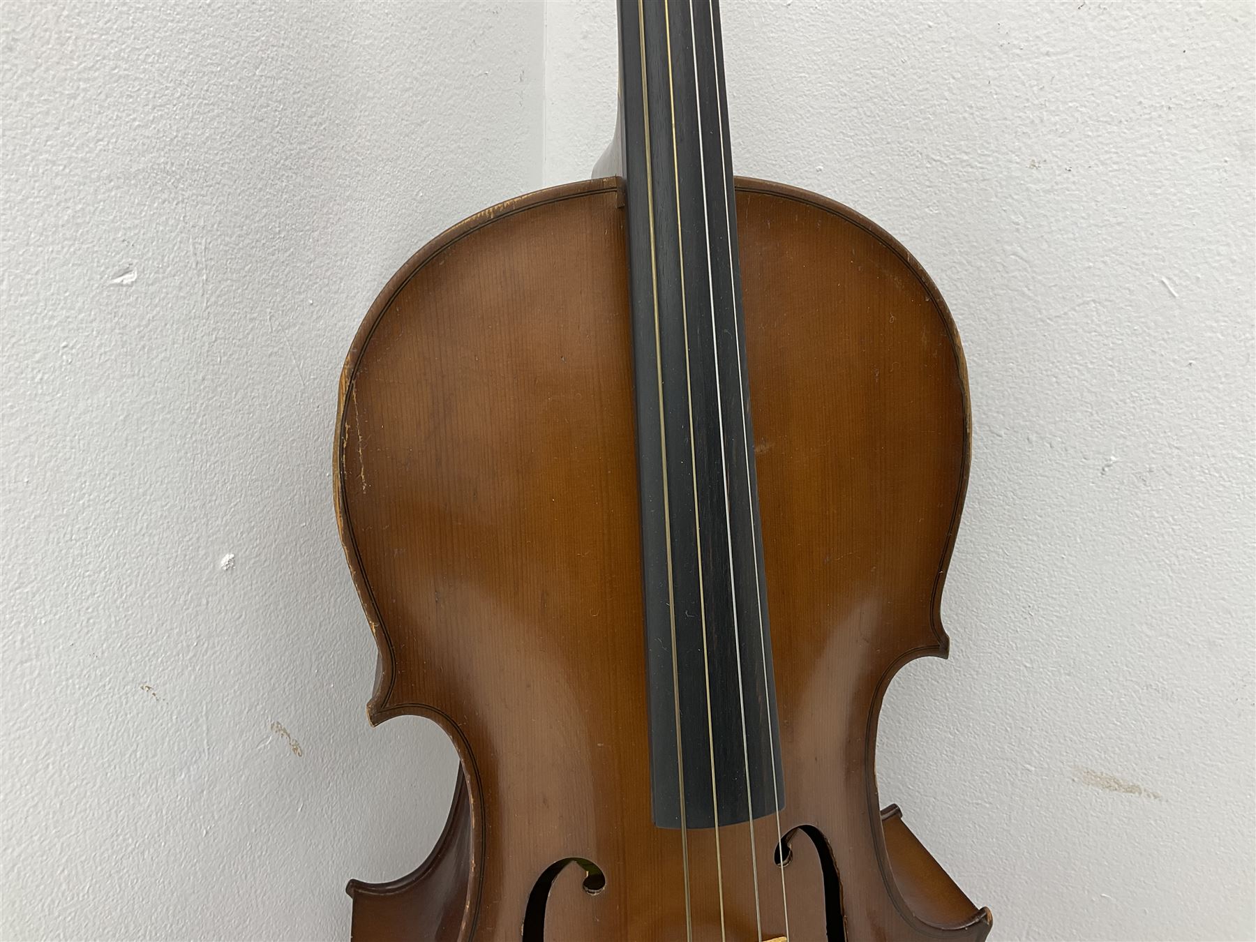 Modern Romanian student's three-quarter size cello with 70cm two-piece maple back and ribs and spruce top, bears label 'Musikinstrumentenfabrik Reghin Romania' L115cm overall