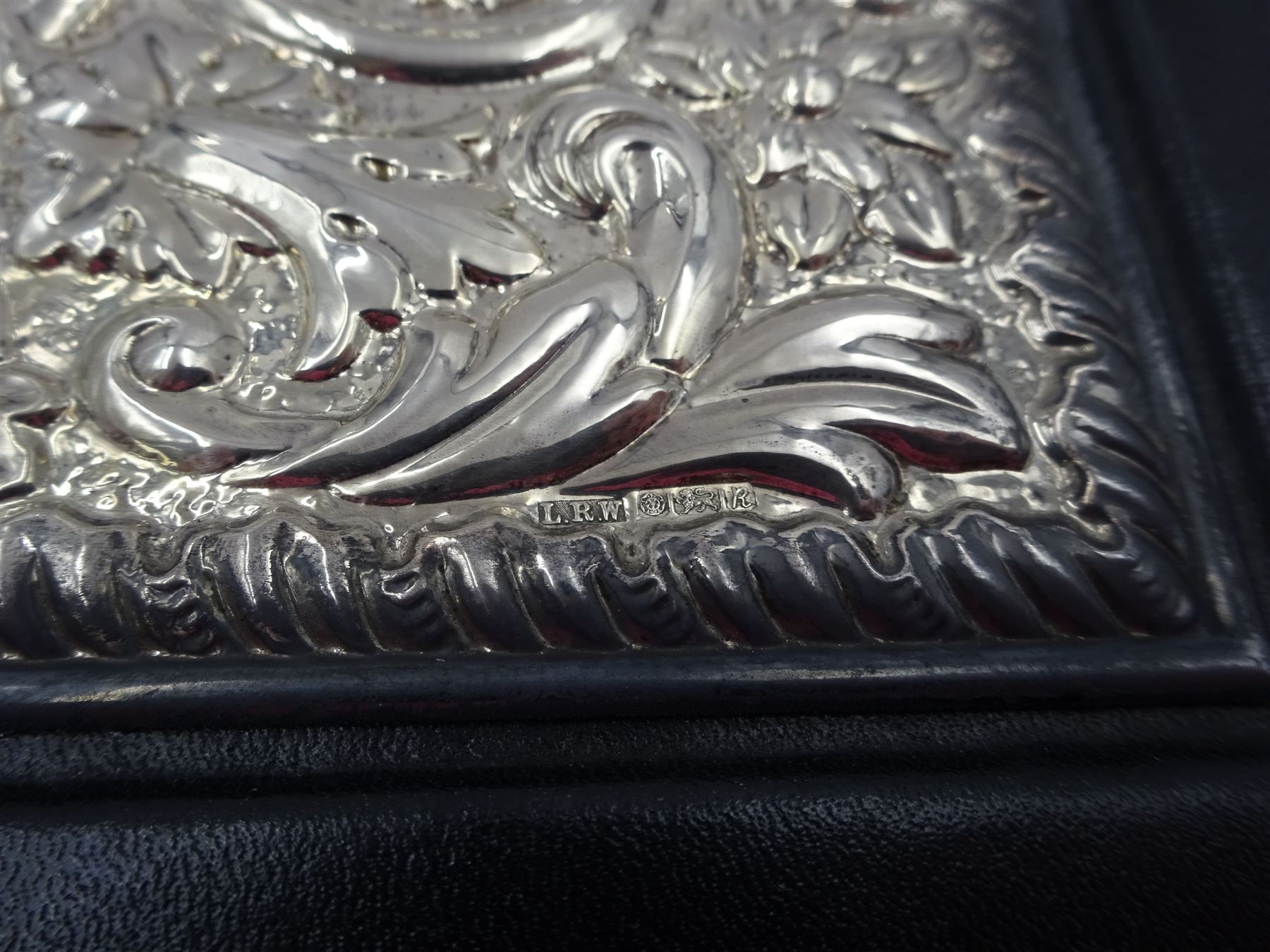 Modern silver mounted leather writing case, with repousse floral and foliate decoration to the silver cover, hallmarked Laurence R Watson & Co, Sheffield 1991, H29.5cm, boxed