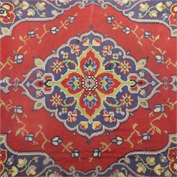 Turkish Malatya type flatwoven rug, decorated with a red medallion field, stylised floral motifs and blue corner panels, enclosed by beige foliate border and outer floral guard band